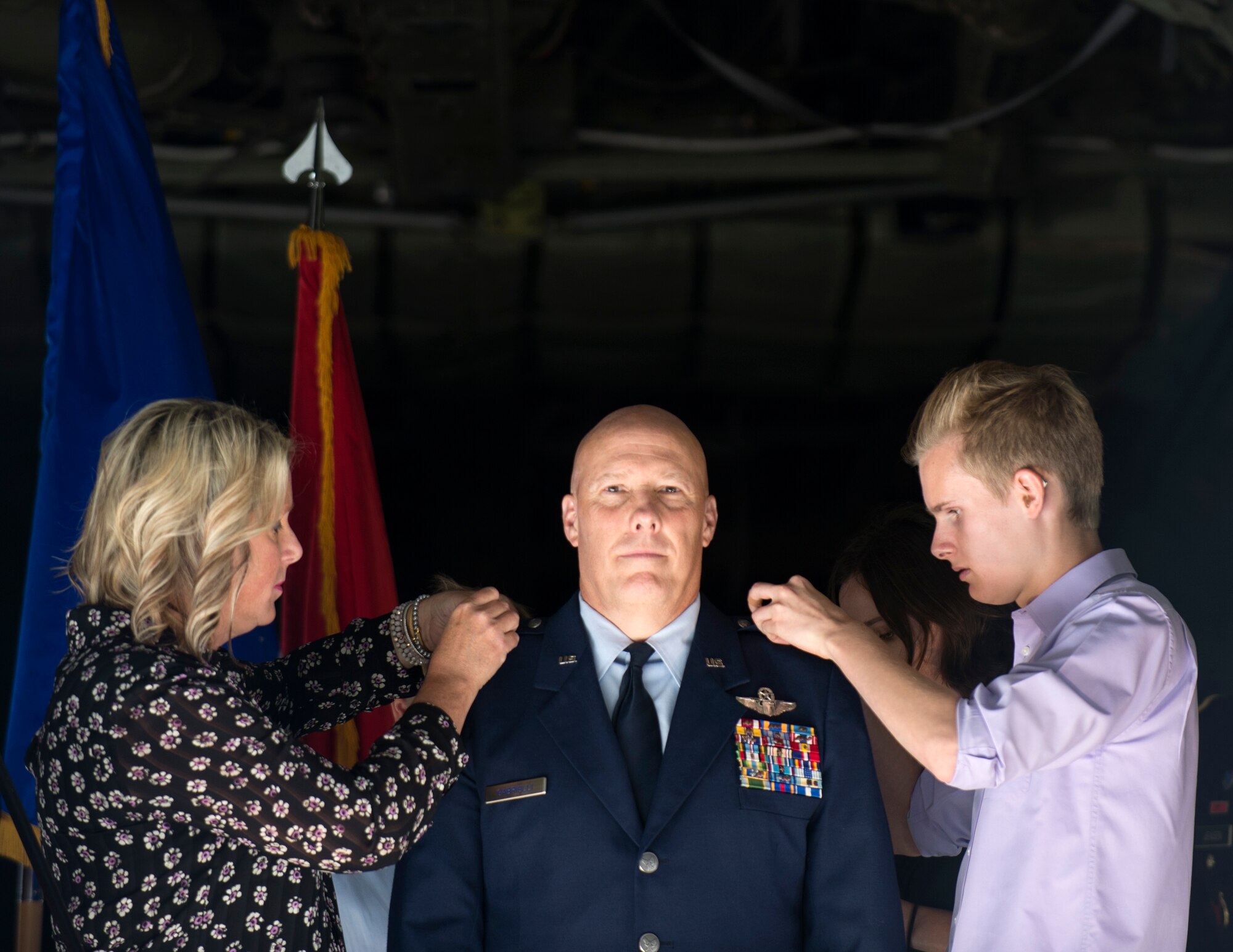 U.S. Air Force Col. Daniel Gabrielli’s wife and son pin on the rank of brigadier general in St. Paul, Minn., Sept. 14, 2019.