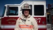 Senior Master Sgt. Andrew Kehl, 99th Civil Engineer Squadron Fire Department deputy fire chief, poses for a photo in front of a fire truck at Nellis Air Force Base, Nevada, July 29, 2019. Kehl was recently honored as one of the Air Force’s 12 Outstanding Airmen of the Year for 2019. (U.S. Air Force photo by Airman 1st Class Bailee A. Darbasie)