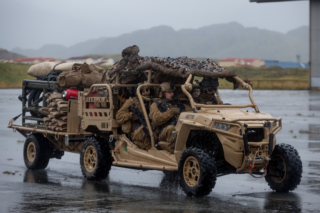 U.S. Marines with Marine Wing Support Squadron 371 transport a tactical air-ground refueling system to a forward arming and refueling point (FARP) during Arctic Expeditionary Capabilities Exercise (AECE) in Adak, Alaska on Sept. 18, 2019. Approximately 3,000 U.S. Navy and Marine Corps personnel are participating in AECE 2019, a joint training exercise that tests expeditionary logistical capabilities in the Arctic region and prepares joint forces to respond to crises across the Indo-Pacific. (U.S. Marine Corps photo by Lance Cpl. Tia D. Carr)