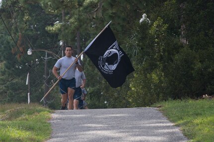 Airman 1st Class Kenneth Frechette, 628th Logistics Readiness Squadron supply technician, leads his group during a POW/MIA memorial run Sep. 20, 2019, at Joint Base Charleston, S.C.