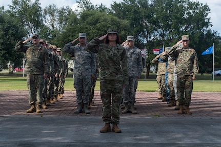 Lt. Col. Christine Smetana, 628th Operational Medical Readiness Squadron commander, leads a flight in rendering a salute during a retreat ceremony Sep. 20, 2019, at Joint Base Charleston, S.C.