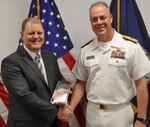 IMAGE: DAHLGREN, Va. (Aug. 30, 2019) – Naval Sea Systems Warfare Centers Commander Rear Adm. Eric Ver Hage presents the Dr. Delores M. Etter Award to Dennis Larsen, Naval Surface Warfare Center Dahlgren Division (NSWCDD) engineer, at an awards ceremony held at NSWCDD headquarters. The Etter Award is presented annually to scientists and engineers who have clearly demonstrated a superior accomplishment that is technically outstanding and highly beneficial operationally to the Department of the Navy, Department of Defense, and national defense.  (Photo by U.S. Navy/Released)