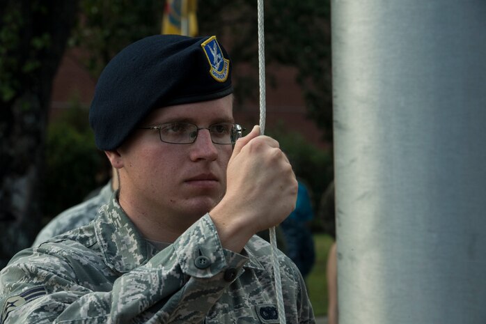 Airman 1st Class Alexander Elkins, 628th Security Forces Squadron installation entry controller, prepares to lower the U.S. Flag during a retreat ceremony Sep. 20, 2019, at Joint Base Charleston, S.C.