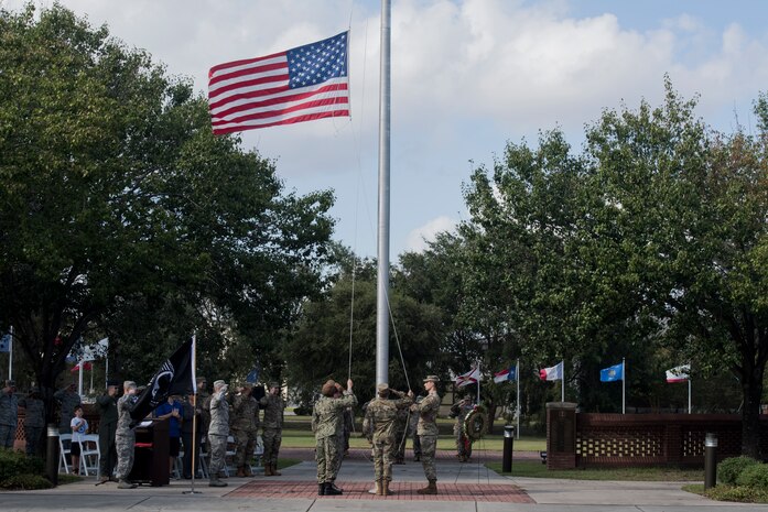 Airmen from Joint Base Charleston lower the U.S. Flag during a retreat ceremony Sep. 20, 2019, at Joint Base Charleston, S.C.