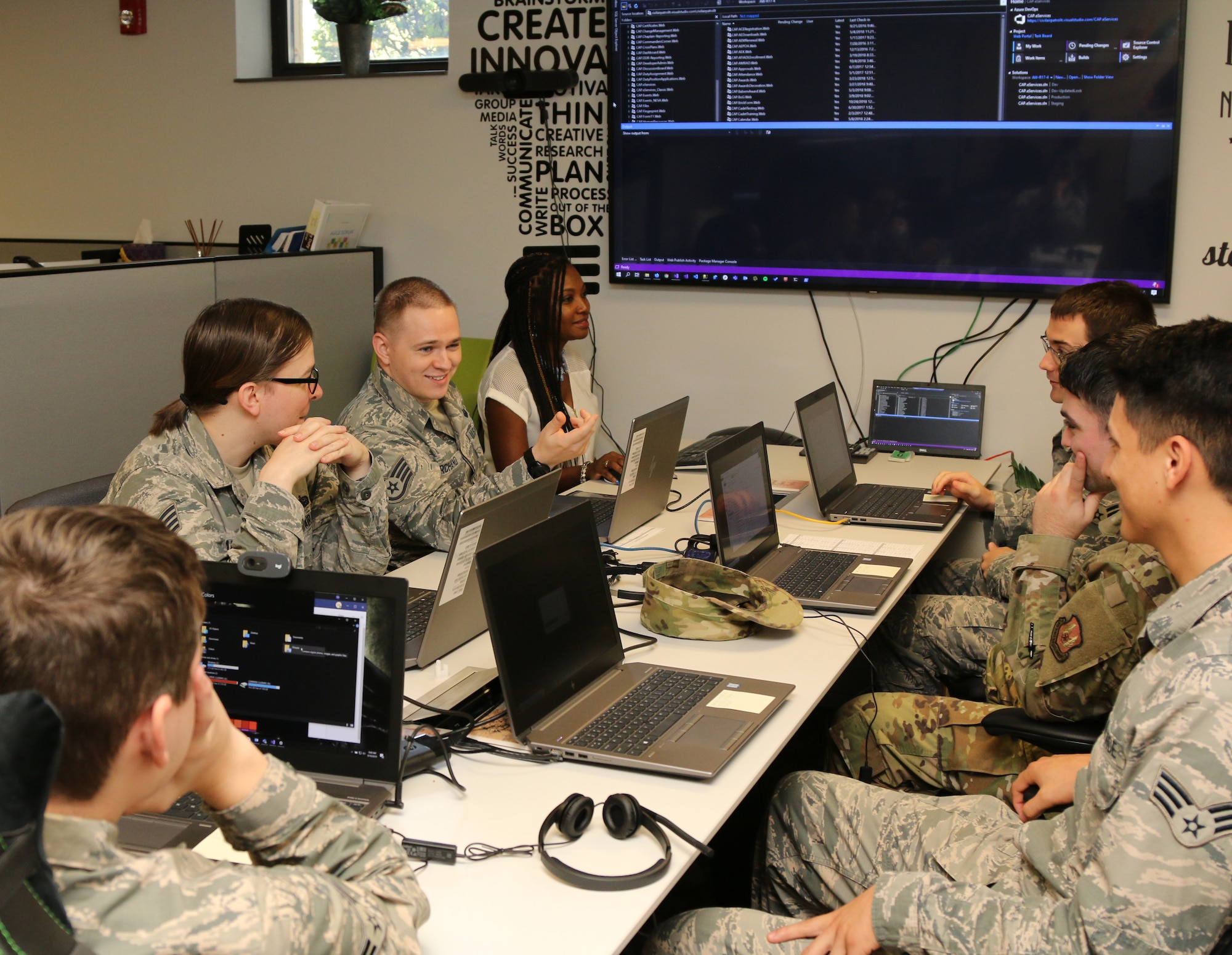 Katrina Jackson (center back) with CAP National Headquarters’ information technology team meets with Airmen from the Program Executive Office-Business Enterprise Systems at CAP’s facilities on Maxwell Air Force Base, Alabama, Sept. 18, 2019. Civil Air Patrol and PEO-BES signed a memorandum of understanding recently that allows newly graduated technical school Airmen to spend six months at CAP to further immerse themselves in software coding while giving CAP additional manpower on its IT development team. (Courtesy photo)