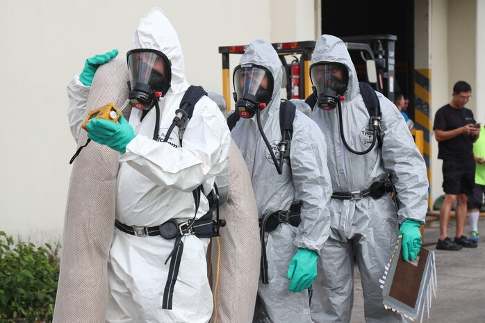 U.S. Marines prepare to enter a mock-contamination site during the Hazardous Waste Operations and Emergency Response course at Camp Foster, Okinawa, Japan, Sept. 19, 2019. A total of 36 students attended the HAZWOPER class which included Marines, sailors and civilians alike.