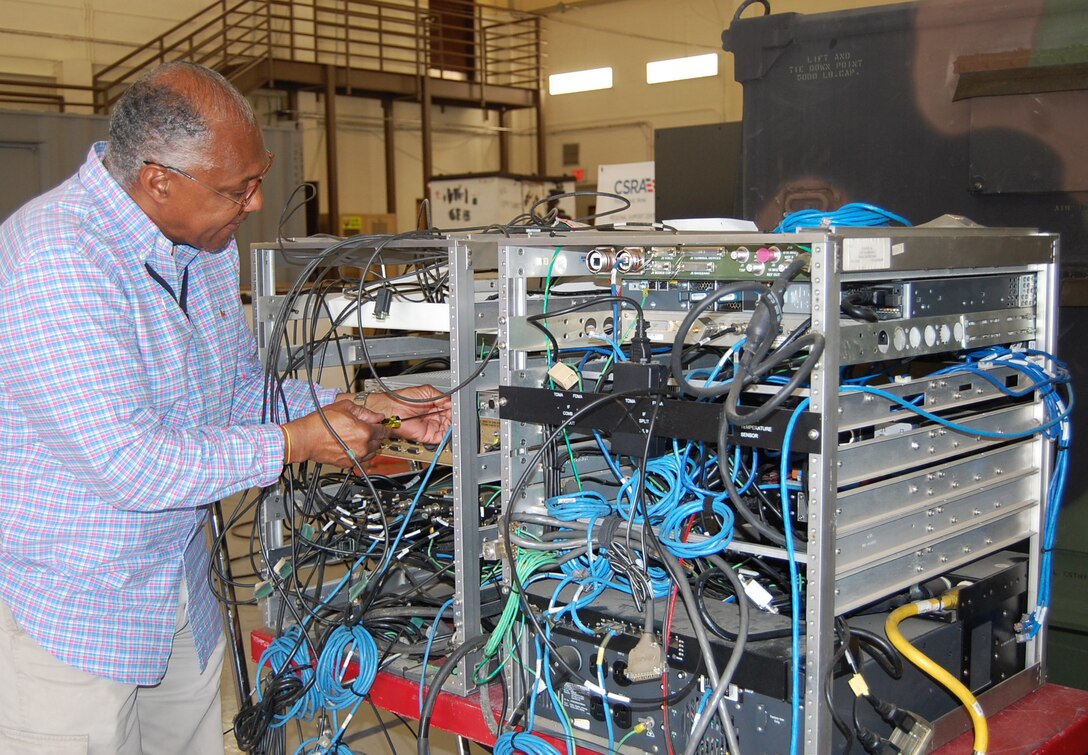 Photo of employee working at our forward repair facility.