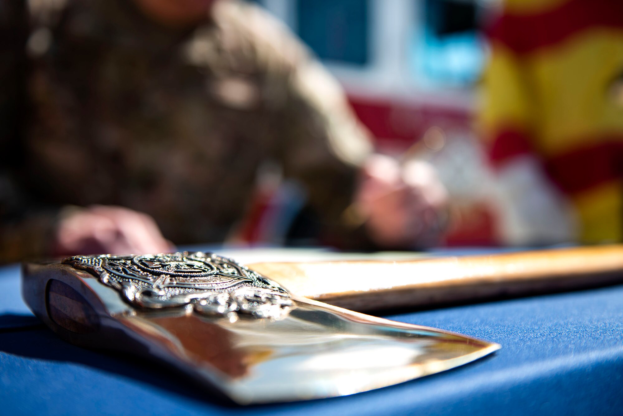 A ceremonial pickhead axe rests on a table while Col. Daniel P. Walls, 23d Wing commander, signs a Fire Prevention Week proclamation Sept. 23, 2019, at Moody Air Force Base, Ga. Walls proclaimed the week of Oct. 6-12 as Fire Prevention Week, which is designed to commemorate the sacrifices of our firefighters and teach fire safety to others. (U.S. Air Force photo by Senior Airman Erick Requadt)