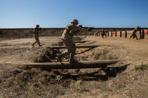 Recruits with Kilo Company, 3rd Recruit Training Battalion, run over logs during field week at Marine Corps Base Camp Pendleton, California Sept. 13.