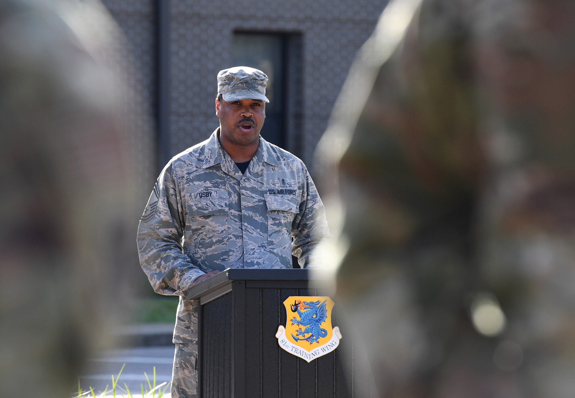 U.S. Air Force Chief Master Sgt. Kevin Osby, 81st Diagnostic and Therapeutics Squadron superintendent, delivers remarks during the POW/MIA retreat ceremony at Keesler Air Force Base, Mississippi, Sept. 20, 2019. The event was held to raise awareness and to pay tribute to all prisoners of war and those military members still missing in action. (U.S. Air Force photo by Kemberly Groue)