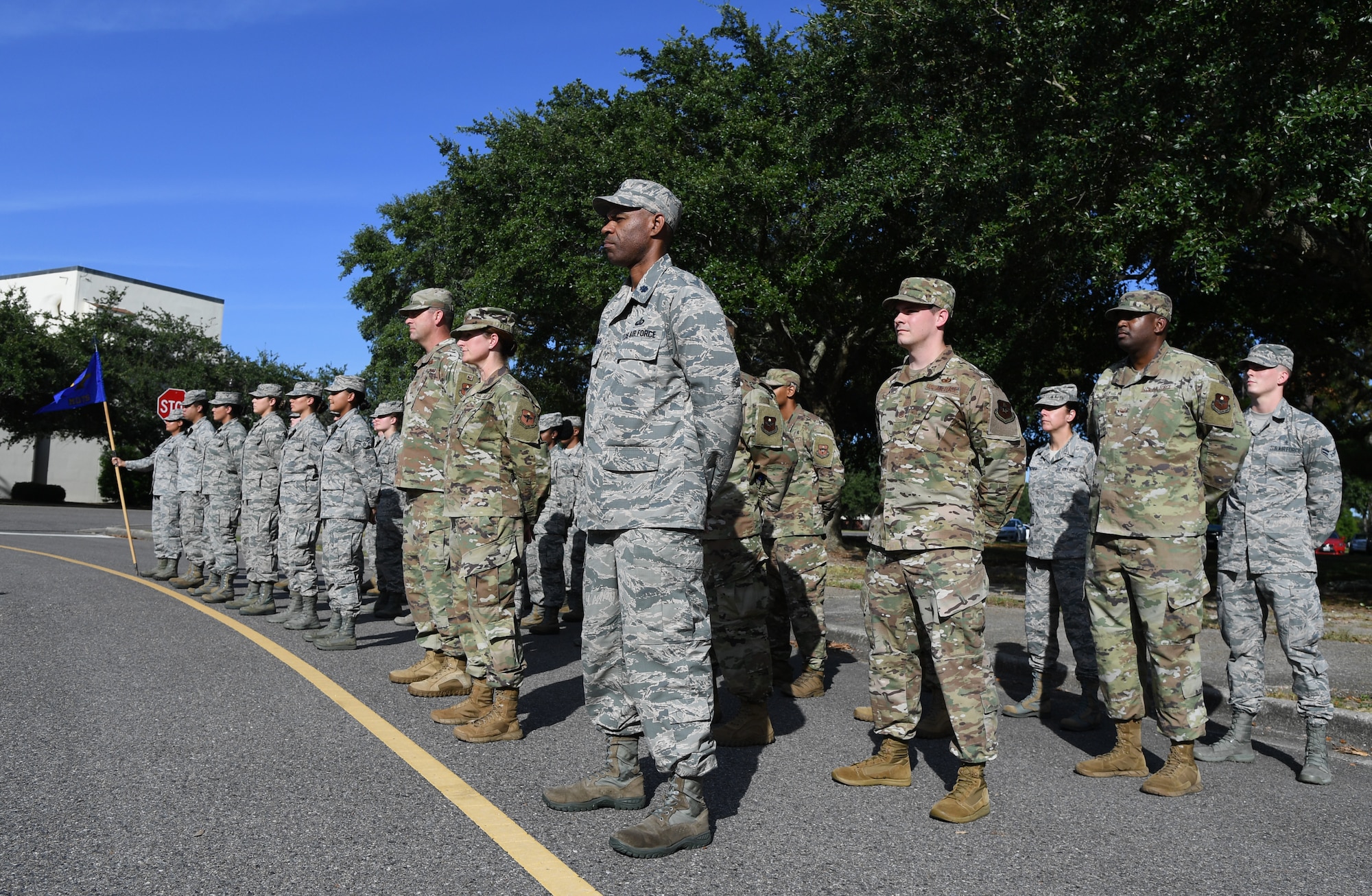 Keesler Airmen stand in formation during the POW/MIA retreat ceremony at Keesler Air Force Base, Mississippi, Sept. 20, 2019. The event was held to raise awareness and to pay tribute to all prisoners of war and those military members still missing in action. (U.S. Air Force photo by Kemberly Groue)