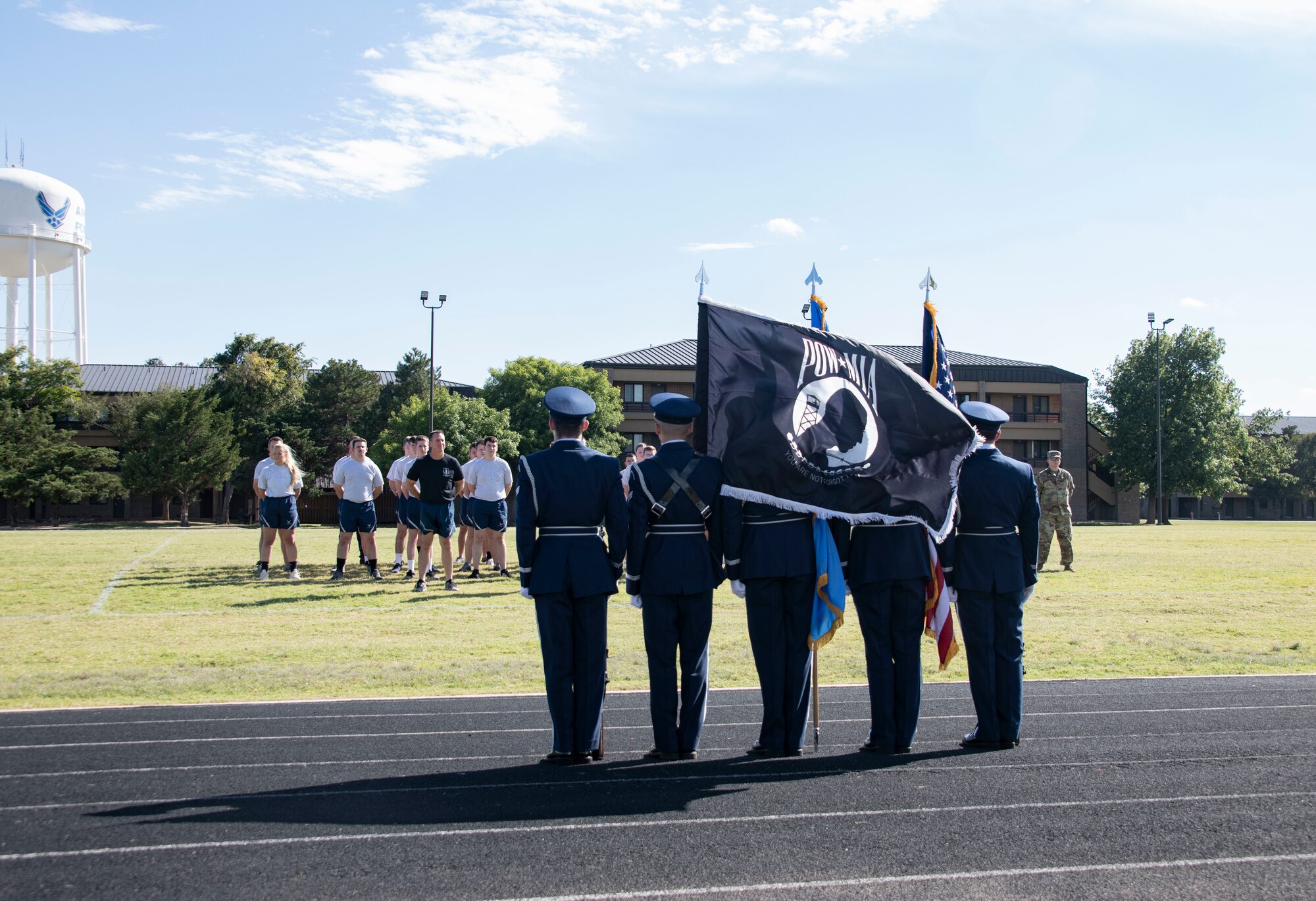 U.S. Air Force Members of the Altus Blue Knights Honor Guard Team assigned to the 97th Air Mobility Wing await the start of the 24-hour POW/MIA remembrance run Sept. 19, 2019, at Altus Air Force Base, Okla. The run took place from reveille on Sept. 19, to reveille on Sept. 20. (U.S. Air Force photo by Senior Airman Cody Dowell)