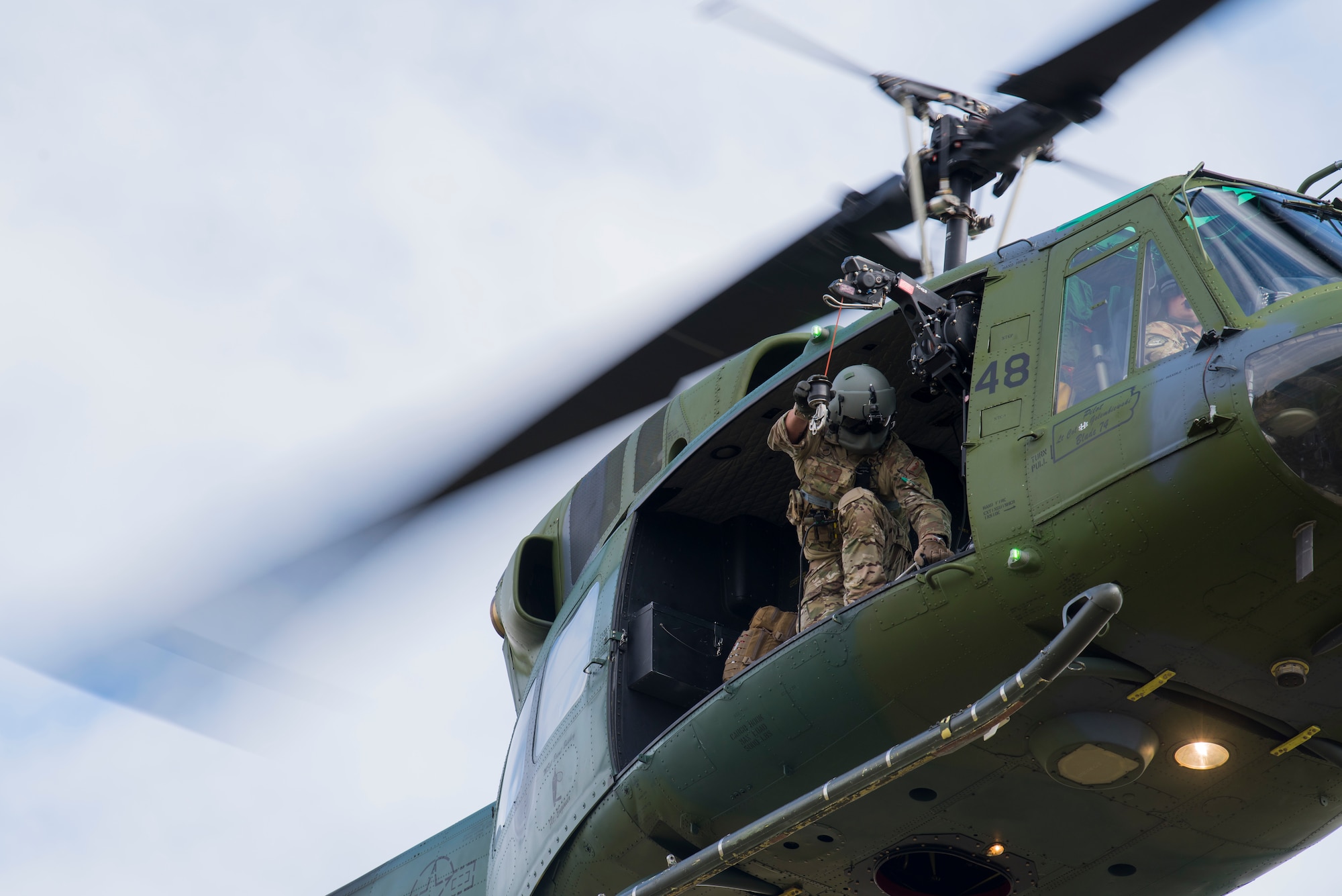 U.S. Air Force Tech. Sgt. Scott Grubaugh, 36th Rescue Squadron flight engineer, performs a medical evacuation demonstration prior to the commemoration ceremony of the 36th RQS reaching 700 saves at Fairchild Air Force Base, Washington, Sept. 20, 2019. The 36th RQS began its operations in 1971, providing support to Survival, Evasion, Resistance and Escape specialists as well as civilian emergency search and rescue coverage of the Inland Northwest. (U.S. Air Force photo by Airman 1st Class Lawrence Sena)