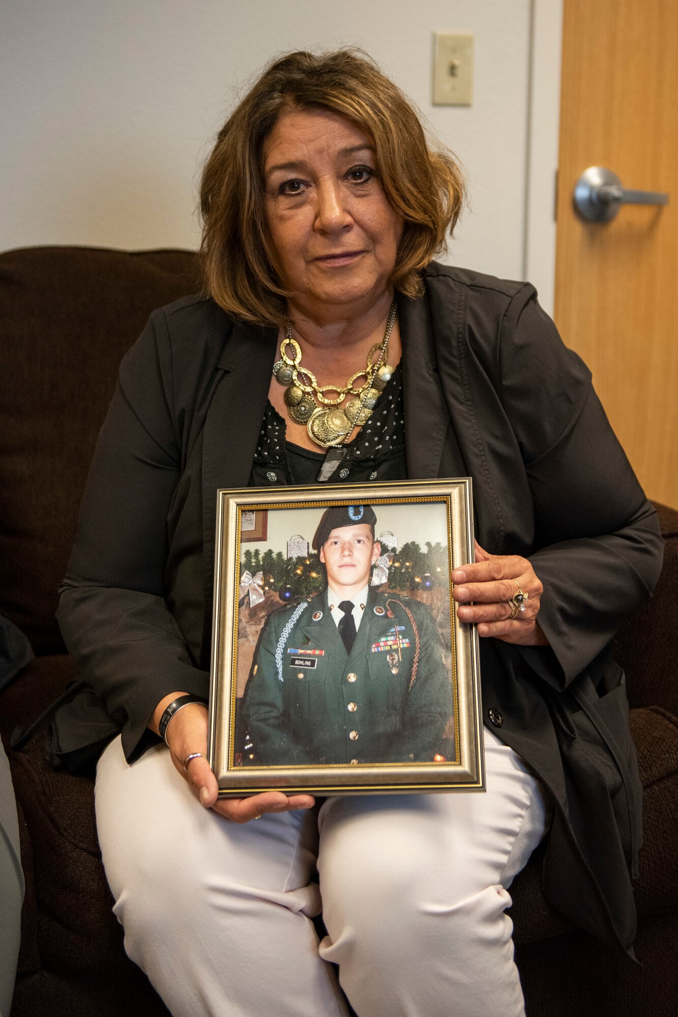 Sandy Bohling, a learning and development training specialist with Southcentral Foundation, and Charles Bohling, a retired U.S. Army National Guard master sergeant, hold photos of their son, Matthew, Sept. 19, 2019 on Joint Base Elmendorf-Richardson, Alaska. Matthew H. Bohling, assigned to the 2nd Battalion, 69th Armor Regiment, 3rd Brigade, 3rd Infantry Division at Fort Benning, Georgia, died in Ramadi, Iraq, Sept. 5, 2005, when an improvised explosive device detonated near his Humvee during combat operations. The last Sunday of September is National Gold Star Mother’s and Family’s Day, a tribute to recognize and honor the immeasurable loss suffered by the surviving parents and families of those killed in action.