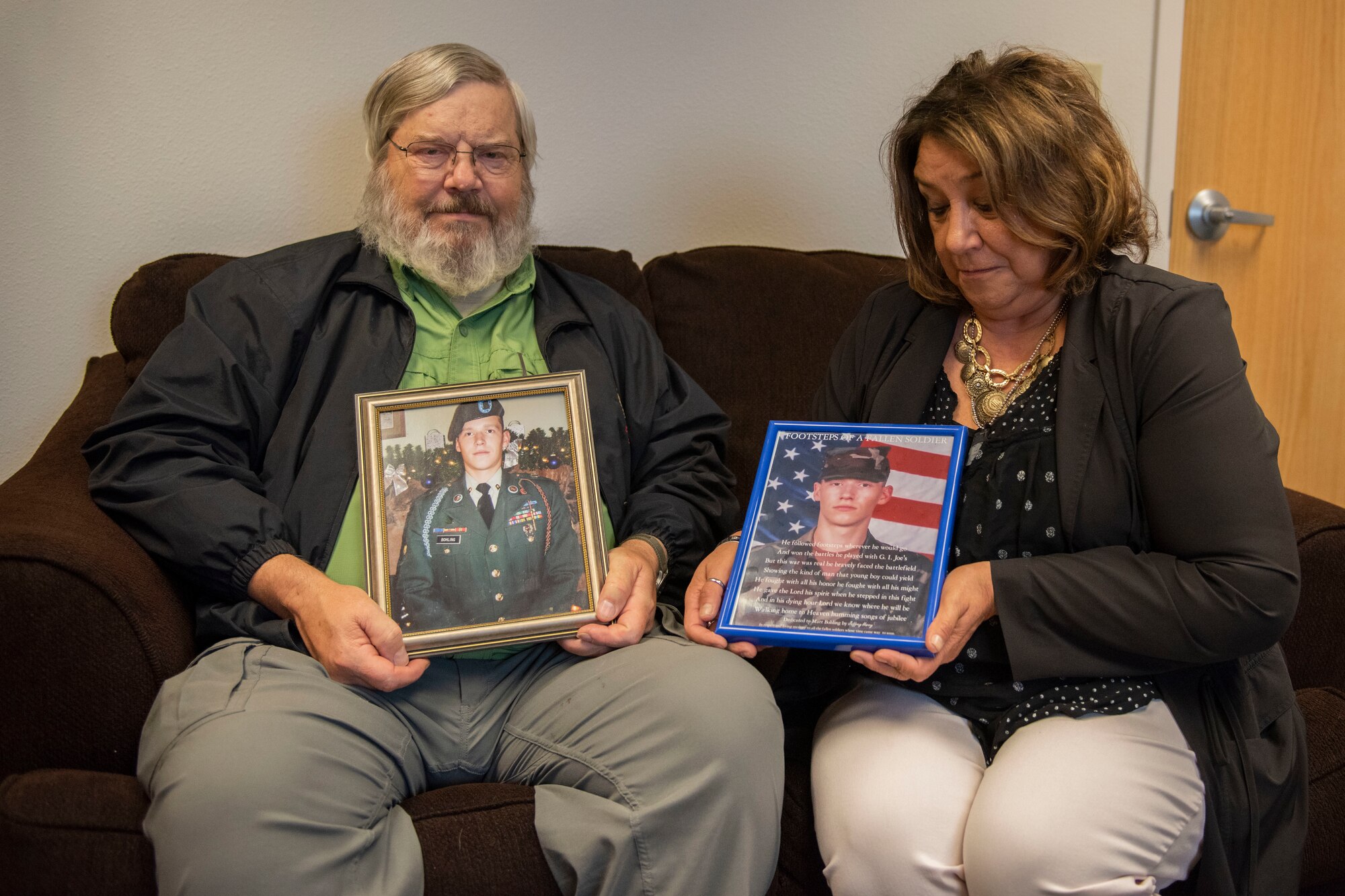 Sandy Bohling, a learning and development training specialist with Southcentral Foundation, and Charles Bohling, a retired U.S. Army National Guard master sergeant, hold photos of their son, Matthew, Sept. 19, 2019 on Joint Base Elmendorf-Richardson, Alaska. Matthew H. Bohling, assigned to the 2nd Battalion, 69th Armor Regiment, 3rd Brigade, 3rd Infantry Division at Fort Benning, Georgia, died in Ramadi, Iraq, Sept. 5, 2005, when an improvised explosive device detonated near his Humvee during combat operations. The last Sunday of September is National Gold Star Mother’s and Family’s Day, a tribute to recognize and honor the immeasurable loss suffered by the surviving parents and families of those killed in action.