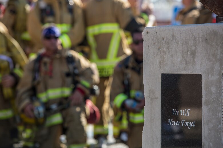 U.S. Marines with Aircraft Rescue and Firefighting (ARFF), Headquarters and Headquarters Squadron (H&HS), Marine Corps Air Station (MCAS) Yuma participate in Yuma's local 9/11 Moving Tribute 5K in Yuma, Ariz., Sept. 11, 2019. MCAS Yuma's ARFF ran alongside local fire departments, and civilians, remembering and honoring the victims of 9/11. The 5K began at City of Yuma Fire Station #3 and finished at City of Yuma Fire Station #1. (U.S. Marine Corps photo by Sgt. Allison Lotz)