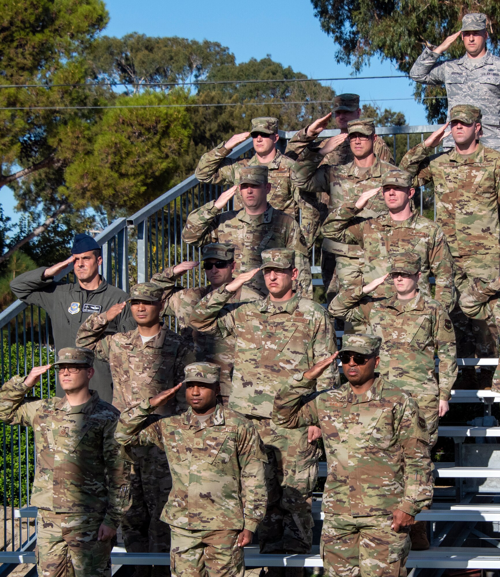 U.S. Air Force service members render a salute during a POW/MIA 24-hour remembrance ceremony Sept 20, 2019, at Travis Air Force Base, California. According to the Defense POW/MIA Accounting Agency, more than 82,000 Americans remain missing from WWII, Korean War, Vietnam War, Cold War, Gulf Wars and other conflicts. (U.S. Air Force photo by Heide Couch)