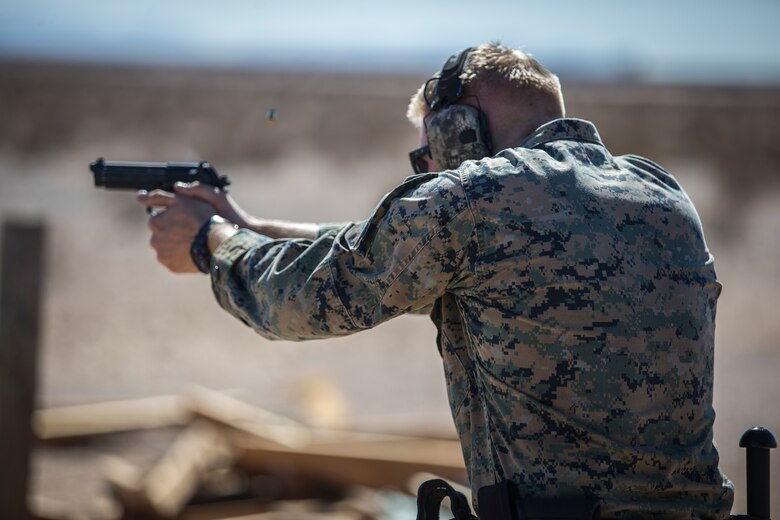 U.S. Marines with the Provost Marshals Office (PMO), Headquarters and Headquarters Squadron, Marine Corps Air Station (MCAS) Yuma, engage targets during a law enforcement (LE) range qualification on MCAS Yuma, Sep. 18th 2019. The LE qualification is specific to military police personnel, including several different shooting methods with both the Beretta M9 and Benelli 12 gauge shotgun. (U.S. Marine Corps photo by Lance Cpl John Hall)