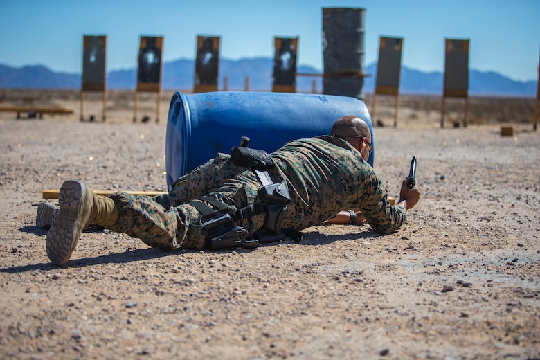 U.S. Marines with the Provost Marshals Office (PMO), Headquarters and Headquarters Squadron, Marine Corps Air Station (MCAS) Yuma, engage targets during a law enforcement (LE) range qualification on MCAS Yuma, Sep. 18th 2019. The LE qualification is specific to military police personnel, including several different shooting methods with both the Beretta M9 and Benelli 12 gauge shotgun. (U.S. Marine Corps photo by Lance Cpl John Hall)