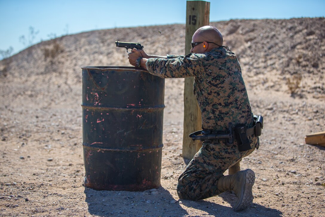 U.S. Marines with the Provost Marshals Office (PMO), Headquarters and Headquarters Squadron, Marine Corps Air Station (MCAS) Yuma, engage targets during a law enforcement (LE) range qualification on MCAS Yuma, Sep. 18th 2019. The LE qualification is specific to military police personnel, including several different shooting methods with both the Beretta M9 and Benelli 12 gauge shotgun. (U.S. Marine Corps photo by Lance Cpl John Hall)