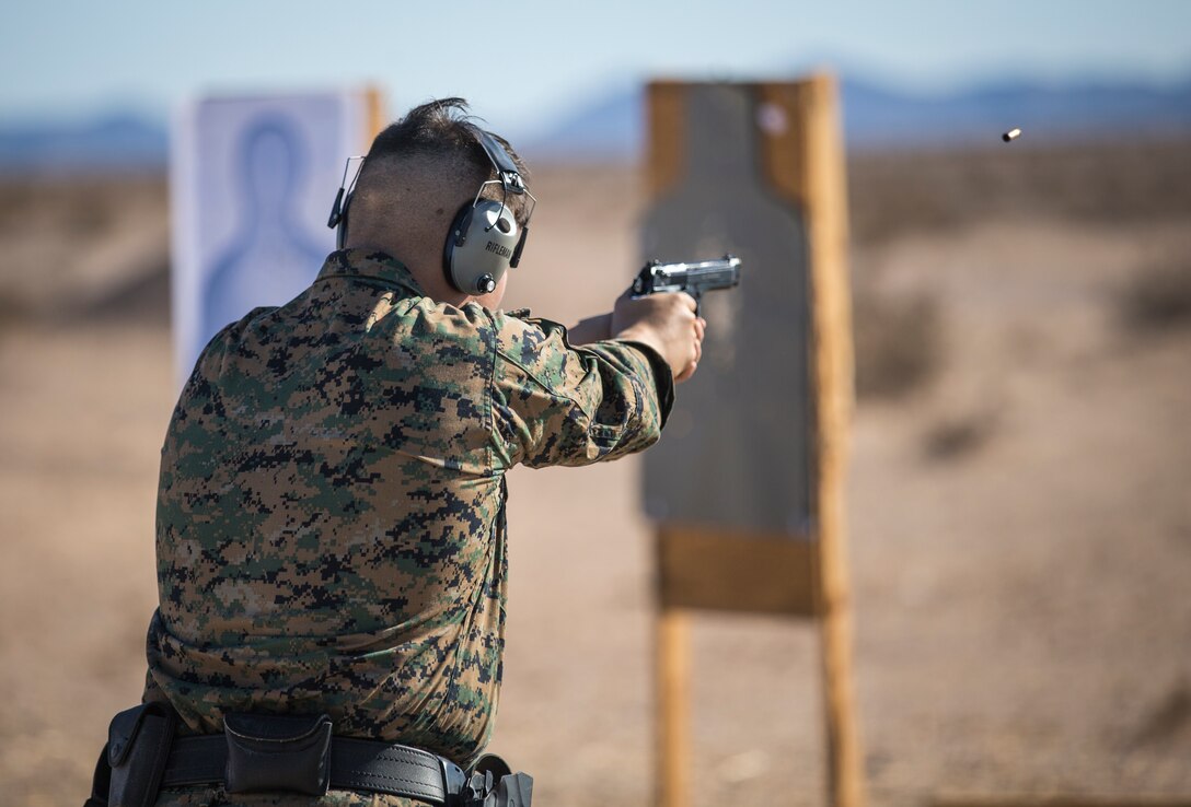 U.S. Marines with the Provost Marshals Office (PMO), Headquarters and Headquarters Squadron, Marine Corps Air Station (MCAS) Yuma, engage targets during a law enforcement (LE) range qualification on MCAS Yuma, Sep. 18th 2019. The LE qualification is specific to military police personnel, including several different shooting methods with both the Beretta M9 and Benelli 12 gauge shotgun. (U.S. Marine Corps photo by Lance Cpl John Hall)