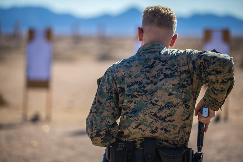 U.S. Marines with the Provost Marshals Office (PMO), Headquarters and Headquarters Squadron, Marine Corps Air Station (MCAS) Yuma, engage targets during a law enforcement (LE) range qualification on MCAS Yuma, Sep. 18th 2019. The LE qualification is specific to military police personnel, including several different shooting methods with both the Beretta M9 and Benelli 12 gauge shotgun. (U.S. Marine Corps photo by Lance Cpl John Hall)