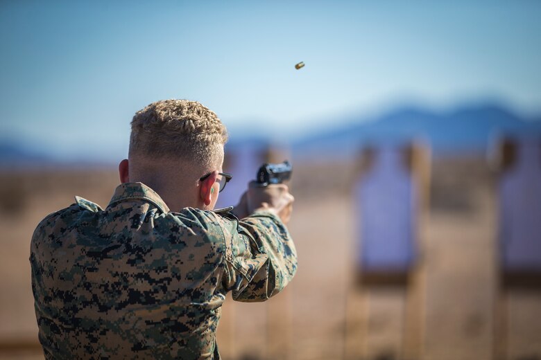 U.S. Marines with the Provost Marshals Office (PMO), Headquarters and Headquarters Squadron, Marine Corps Air Station (MCAS) Yuma, engage targets during a law enforcement (LE) range qualification on MCAS Yuma, Sep. 18th 2019. The LE qualification is specific to military police personnel, including several different shooting methods with both the Beretta M9 and Benelli 12 gauge shotgun. (U.S. Marine Corps photo by Lance Cpl John Hall)