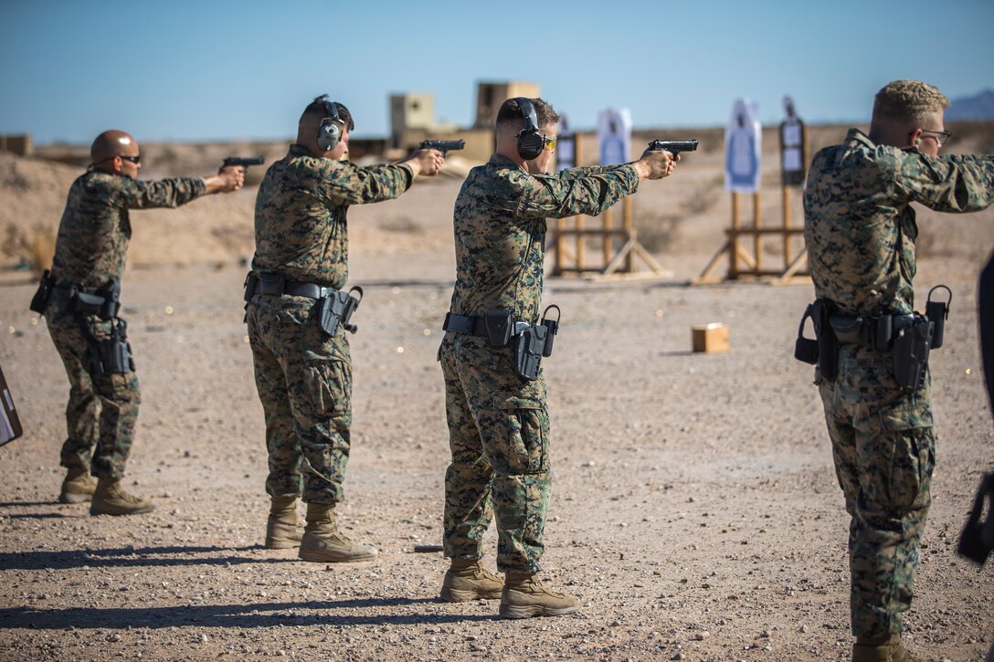 U.S. Marines with the Provost Marshals Office (PMO), Headquarters and Headquarters Squadron, Marine Corps Air Station (MCAS) Yuma, engage targets during a law enforcement (LE) range qualification on MCAS Yuma, Sep. 18th 2019. The LE qualification is specific to military police personnel, including several different shooting methods with both the Beretta M9 and Benelli 12 gauge shotgun. (U.S. Marine Corps photo by Lance Cpl John Hall)