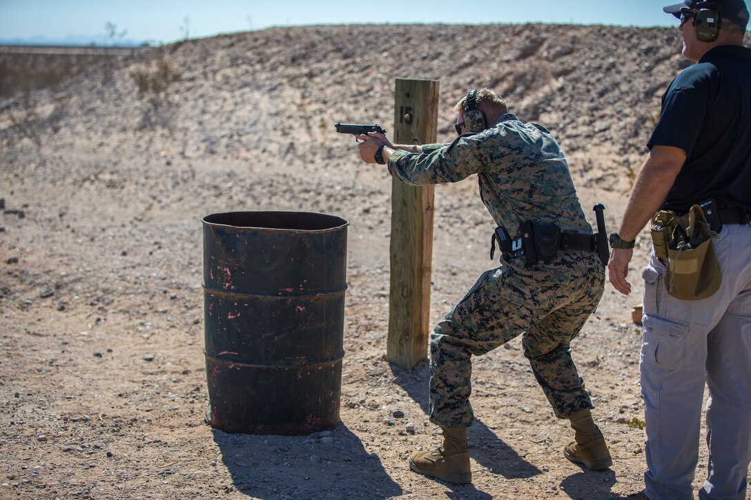 U.S. Marines with the Provost Marshals Office (PMO), Headquarters and Headquarters Squadron, Marine Corps Air Station (MCAS) Yuma, engage targets during a law enforcement (LE) range qualification on MCAS Yuma, Sep. 18th 2019. The LE qualification is specific to military police personnel, including several different shooting methods with both the Beretta M9 and Benelli 12 gauge shotgun. (U.S. Marine Corps photo by Lance Cpl John Hall)