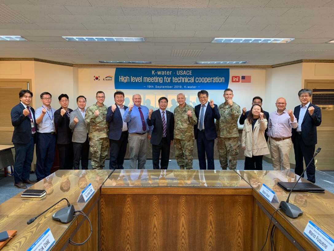K-water Chief Research Officer Dr. Park, Jae Young (center), Maj. Gen. Anthony C. Funkhouser (center right) and senior leaders pose for a group photo.