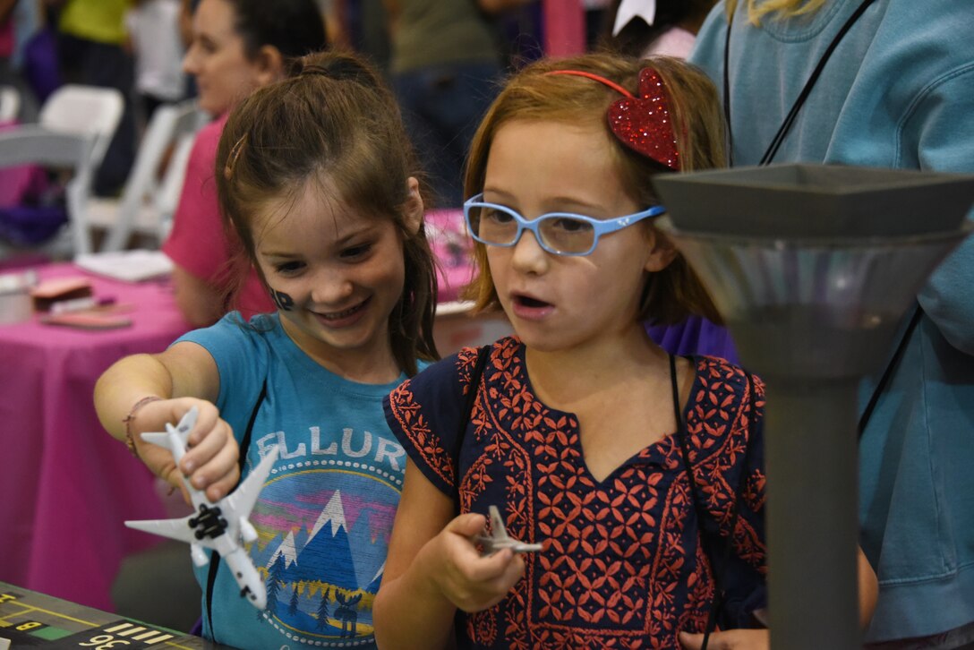 Children play with toy aircraft