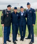 U.S. Army Sgt. Maj. Ernesto Lopez Jr., left, Air Force Airman Basic Jennifer Lopez-Falcon, Airman 1st Class Joanna Lopez, and Senior Airman Ernesto Lopez-Falcon pose for a family photo after Airman Jennifer Lopez-Falcon's basic military training graduation at Lackland Air Force Base, Texas, May 10, 2019.