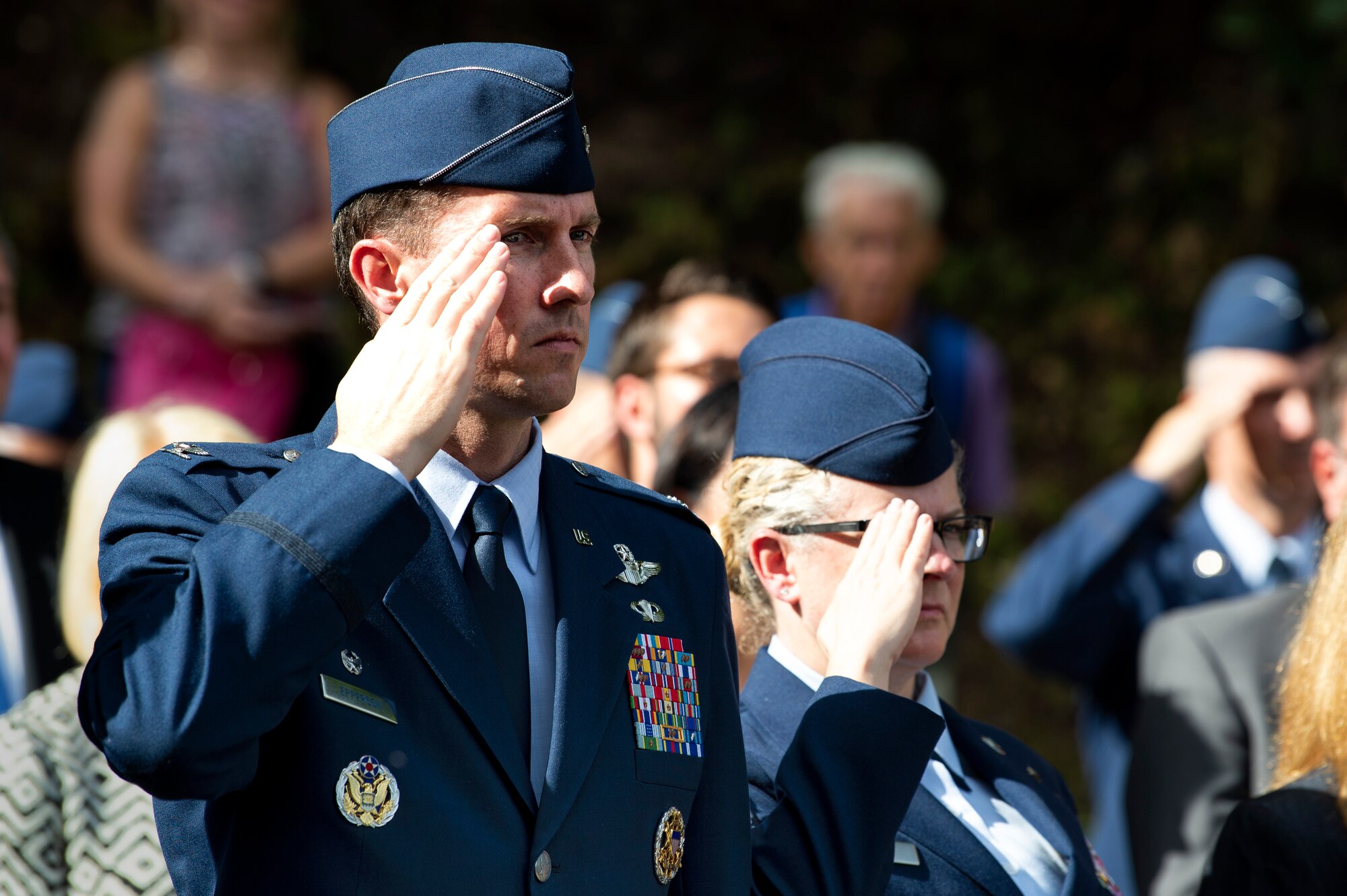 U.S. Air Force Col. David Epperson, 52nd Fighter Wing commander, left, and Chief Master Sgt. Stephanie Cates, 52nd FW command chief, right, render a salute during a ceremony in celebration of the 75th anniversary of the liberation of Ettelbruck, Luxembourg, at the Lt. Gen. Patton Monument in Ettelbruck, Sept. 22, 2019. American and Allied forces liberated the town in 1944 after nearly five years of enemy occupation. (U.S. Air Force photo by Airman 1st Class Valerie Seelye)