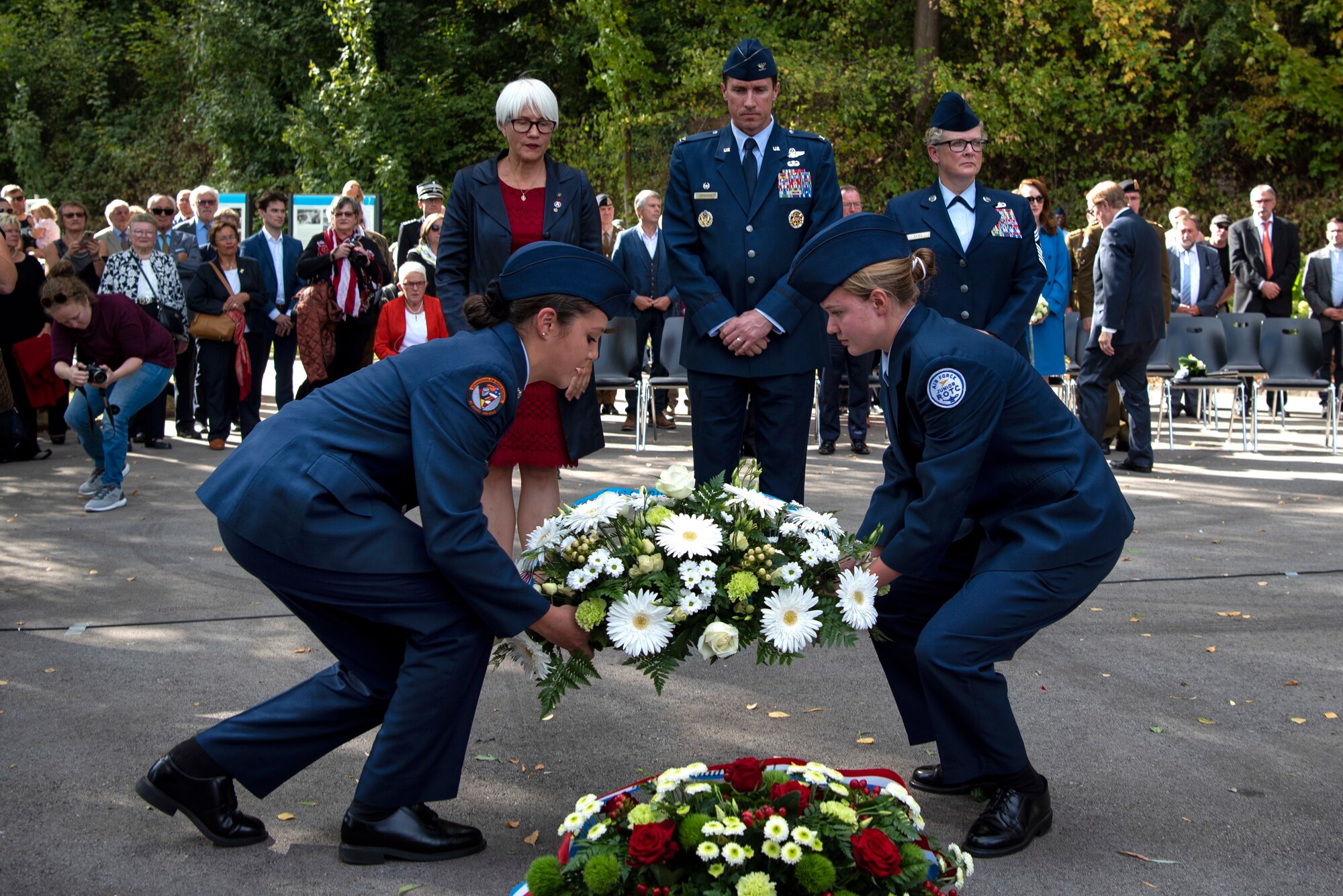 U.S. Air Force Col. David Epperson, 52nd Fighter Wing commander, center back, Chief Master Sgt. Stephanie Cates, 52nd FW command chief, back right, and Helen Patton, granddaughter of Lt. Gen. George Patton, back left, watch as members of the Spangdahlem Air Base High School Junior Reserve Officer Training Corps prepare to lay a wreath during a ceremony in celebration of the 75th anniversary of the liberation of Ettelbruck, Luxembourg, at the Lt. Gen. Patton Monument in Ettelbruck, Sept. 22, 2019. Official parties placed wreathes by the monument in commemoration of those who lost their lives fighting for Luxembourg's liberation. (U.S. Air Force photo by Airman 1st Class Valerie Seelye)