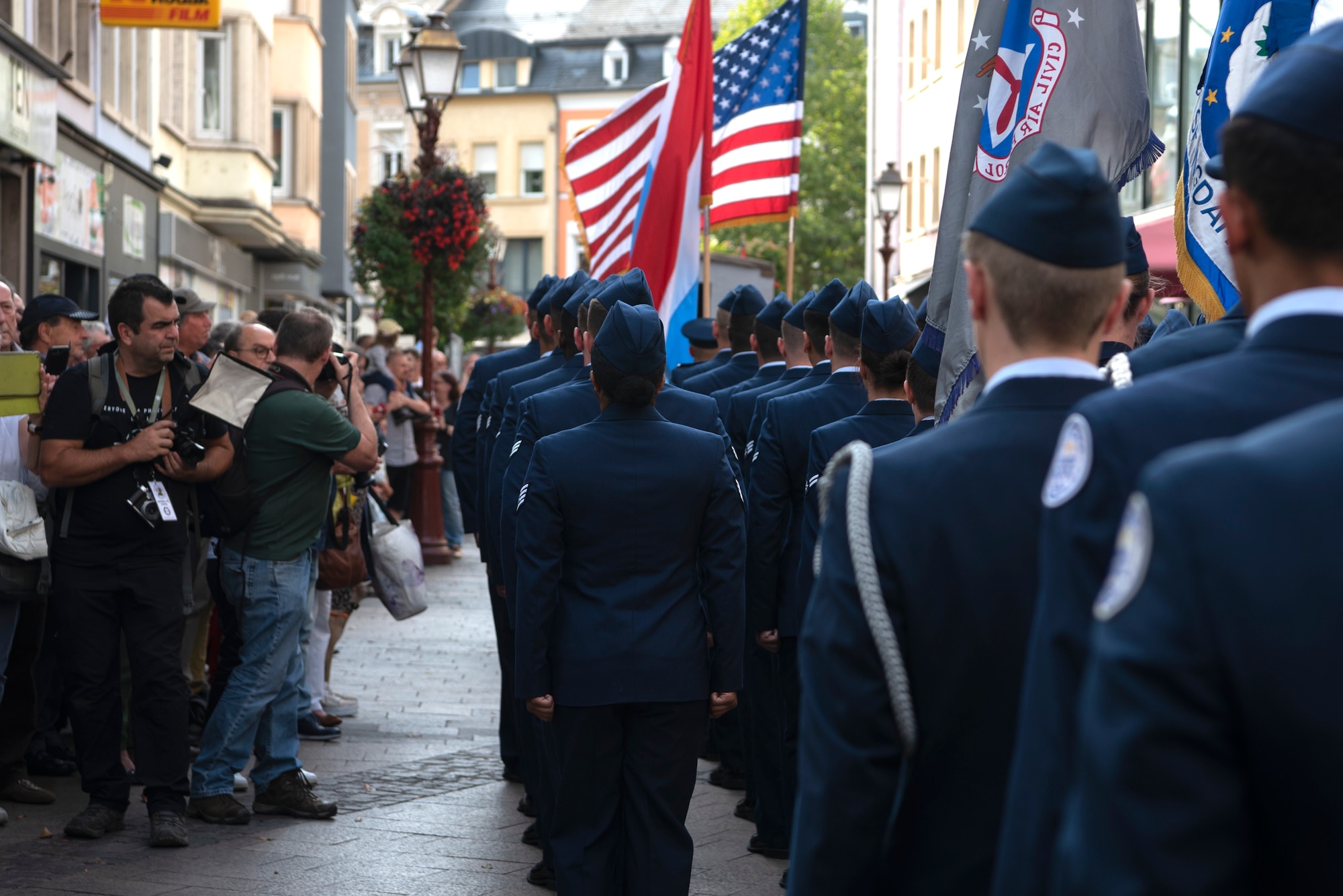 Luxembourgers watch as U.S. Air Force Airmen from Spangdahlem Air Base, Germany, march during a parade in celebration of the 75th anniversary of the liberation of Ettelbruck, Luxembourg, through the town of Ettelbruck, Sept. 22, 2019. The event served as a reminder that U.S. and European Allies continue to work together to maintain freedom and stay at peace. (U.S. Air Force photo by Airman 1st Class Valerie Seelye)