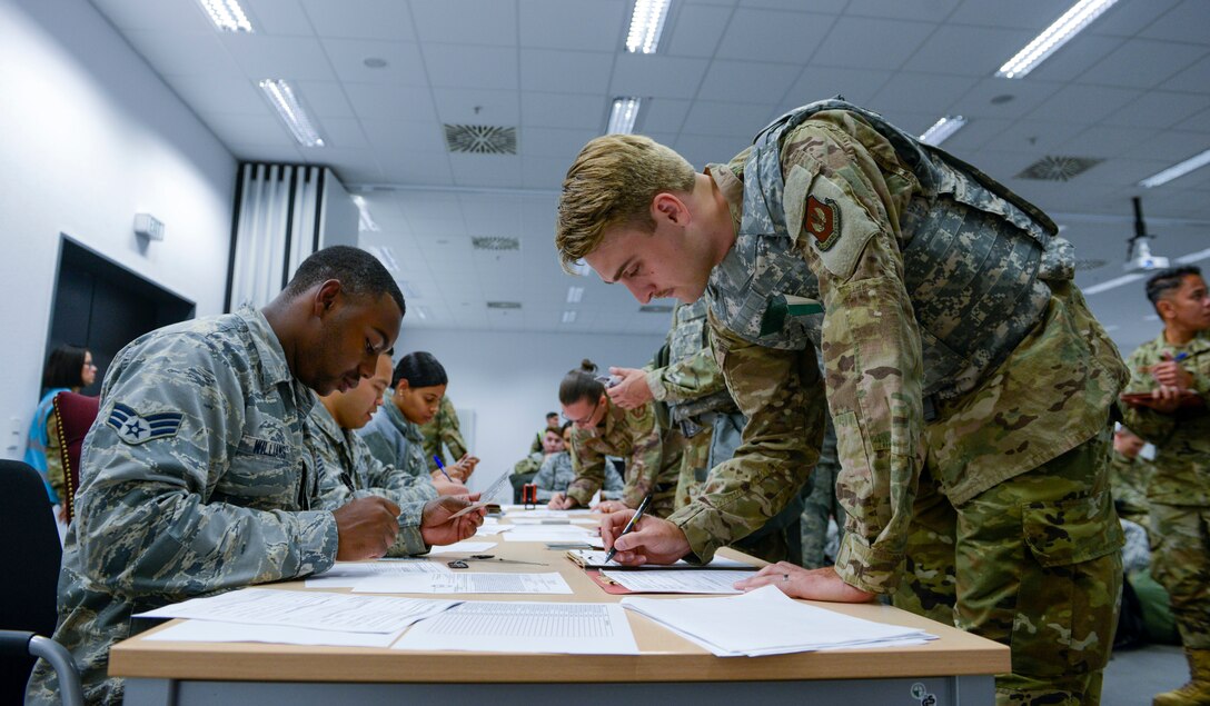 U.S. Air Force Senior Airman Johnathan Williams, 786th Force Support Squadron, processes Airmen through a personnel deployment function line during Operation Varsity 19-3 at Ramstein Air Base, Germany, Sept. 23, 2019. Operation Varsity 19-3 is a weeklong exercise designed to test the capabilities of Airmen assigned to Ramstein Air Base. (U.S. Air Force photo by Tech. Sgt. Timothy Moore)