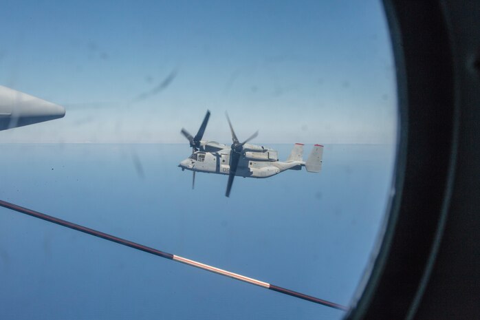 An MV-22 Osprey prepares to conduct air-to-air refueling from a KC-130J Hercules during the Marine Rotational Force - Darwin trans-Pacific flight, at sea, Sep. 17, 2019. The flight was conducted to improve upon the Osprey trans-Pacific concept that has been developed and refined over the past three MRF-D iterations.