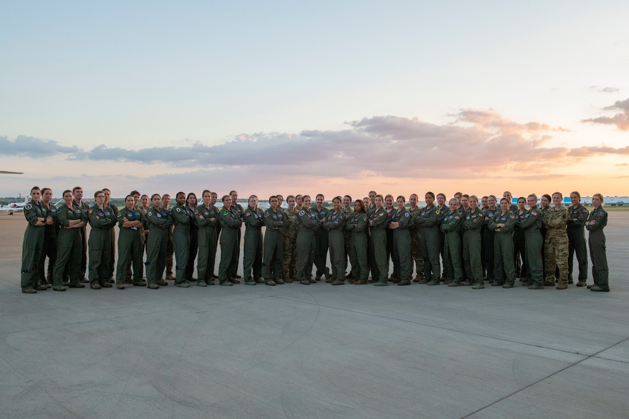 Women aviators pose for a photo.