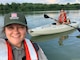 A Blue Marsh Lake Ranger takes a selfie photo with another Ranger while kayaking.