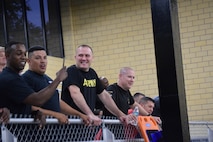 Team members cheer on their battalion commanders during the "Boat Wars" competition at Gammon Physical Fitness Center, Fort Knox, Kentucky, Sept. 22. The "Boat War" was a team building exercise that leadership teams participated in during the 3rd Recruiting Brigade's three-day training forum.