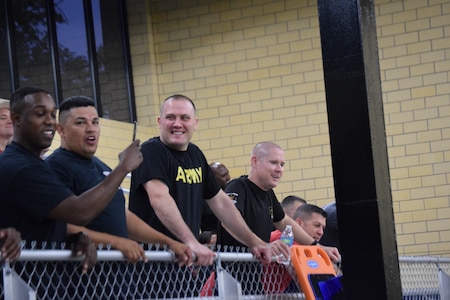 Team members cheer on their battalion commanders during the "Boat Wars" competition at Gammon Physical Fitness Center, Fort Knox, Kentucky, Sept. 22. The "Boat War" was a team building exercise that leadership teams participated in during the 3rd Recruiting Brigade's three-day training forum.