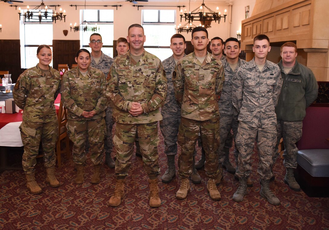Chief Master Sgt. Randy Kwiatkowski, Third Air Force command chief, poses for a photo with Team Mildenhall Airmen during a visit to RAF Mildenhall, England, Sept. 13, 2019. The newly-minted command chief met and spoke with Airmen about concepts related to mindfulness, time management, responsibilities to the mission and resiliency amongst other topics. (U.S. Air Force photo by Airman 1st Class Brandon Esau)