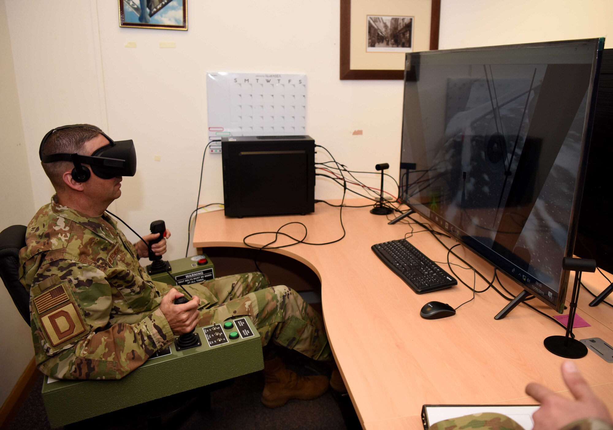 Chief Master Sgt. Randy Kwiatkowski, Third Air Force command chief, demos a de-icing simulator during a visit to RAF Mildenhall, England, Sept. 13, 2019. The newly-minted command chief met and spoke with Airmen about concepts related to mindfulness, time management, responsibilities to the mission and resiliency amongst other topics. (U.S. Air Force photo by Airman 1st Class Brandon Esau)