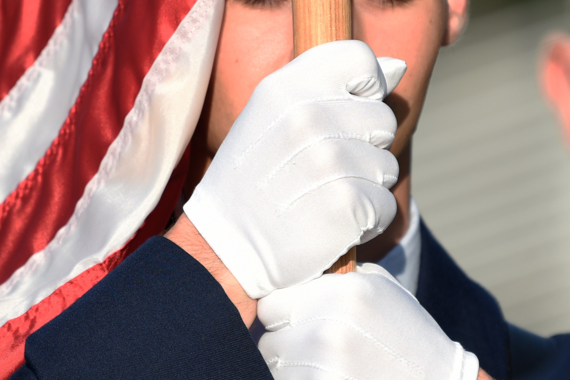 A member of the 81st Training Group honor guard prepares for a performance before the 81st TRG drill down on the Levitow Training Support Facility drill pad at Keesler Air Force Base, Mississippi, Sept. 20, 2019. Airmen from the 81st TRG competed in a quarterly open ranks inspection, regulation drill routine and freestyle drill routine. While in training, Airmen are given the opportunity to volunteer to learn and execute drill down routines. (U.S. Air Force photo by Airman Seth Haddix)