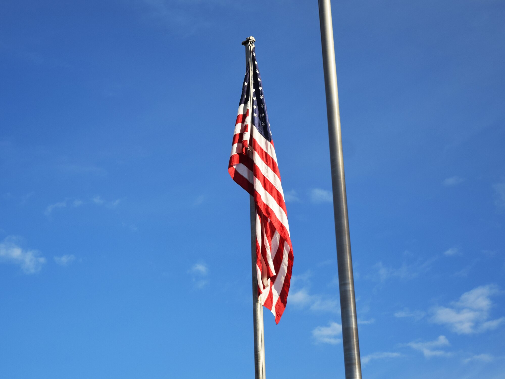 During reveille on Sept. 16, 2019, members of the High Frontier Honor Guard raised the prisoner of war/missing in action flag to mark the beginning of POW/MIA Remembrance Week on Peterson Air Force Base, Colorado. (U.S. Air Force photo by Griffin Swartzell)