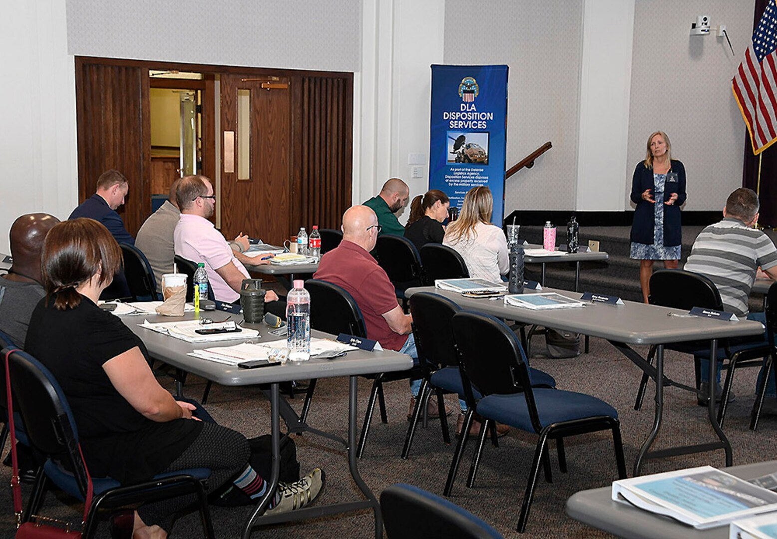 GSA Southwest Central Branch Chief Ericka Grim gives a brief on sales contracting at DLA Disposition Services headquarters in Battle Creek, Michigan, as part of a week of combined agency training in September.