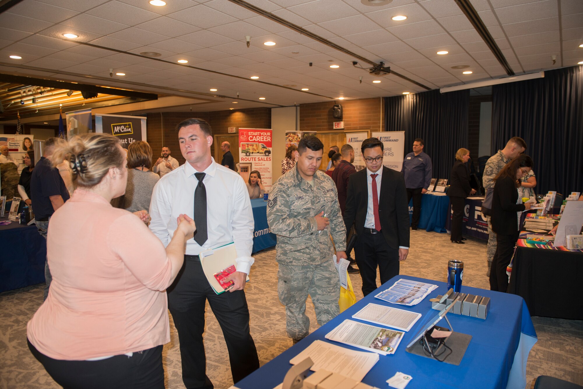 Base members attend several booths during the annual job fair event, sept 18, 2019, at Mountain Home Air Force Base, Idaho. The annual job fair was hosted to support taking care of Airmen and their families by showcasing over 57 employers. (U.S. Air Force photo by Senior Airman JaNae Capuno)