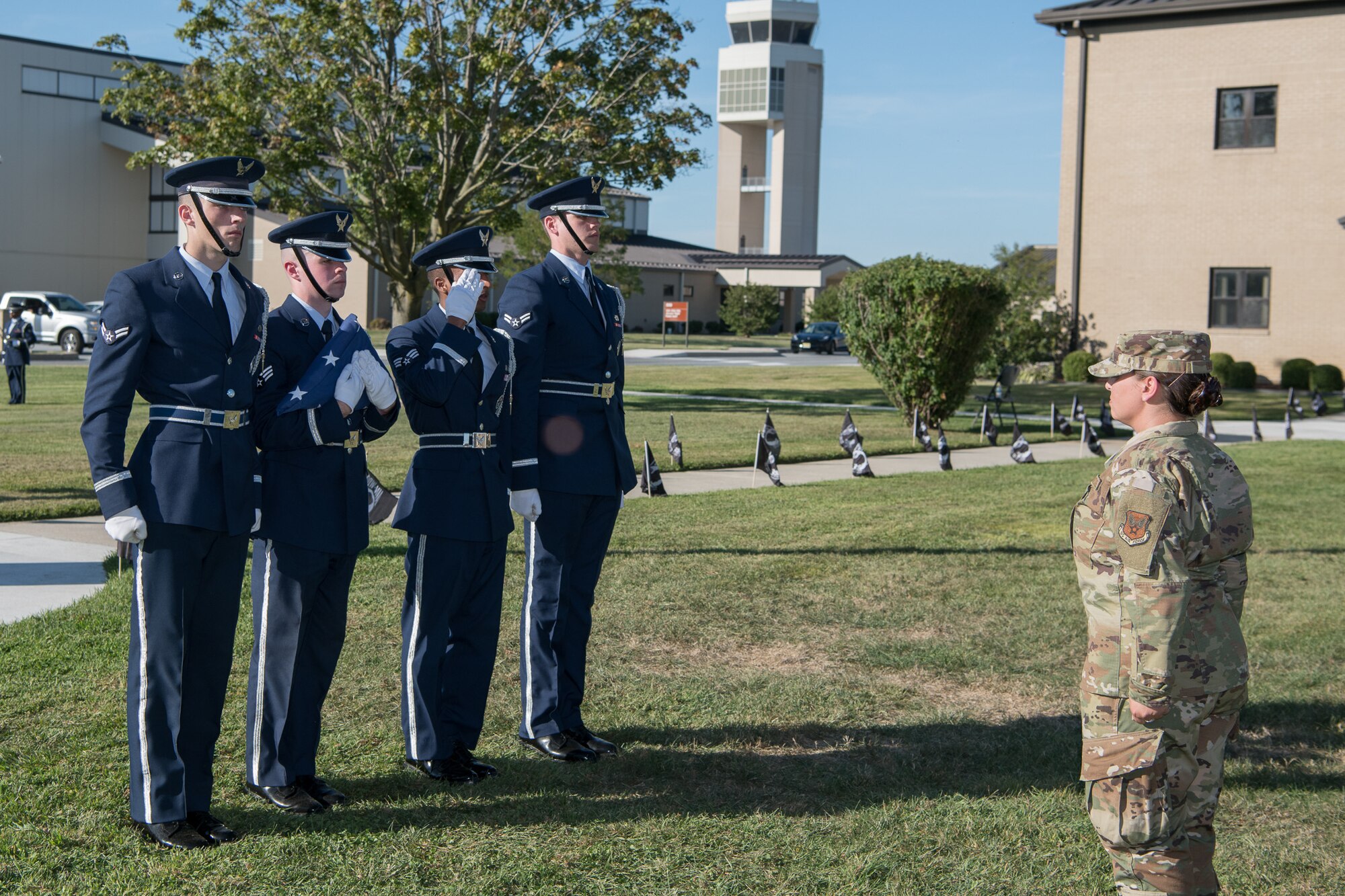 Capt. Ashelyn Diaz orders members of the Dover Air Force Base Honor Guard to retire the colors during a retreat ceremony commemorating National POW/MIA Recognition Day Sept. 20, 2019, at Dover Air Force Base, Del. The National POW/MIA Recognition Day is a day of remembrance of the sacrifices and service of those who were prisoners of war, as well as those who are still missing in action. (U.S. Air Force photo by Mauricio Campino)