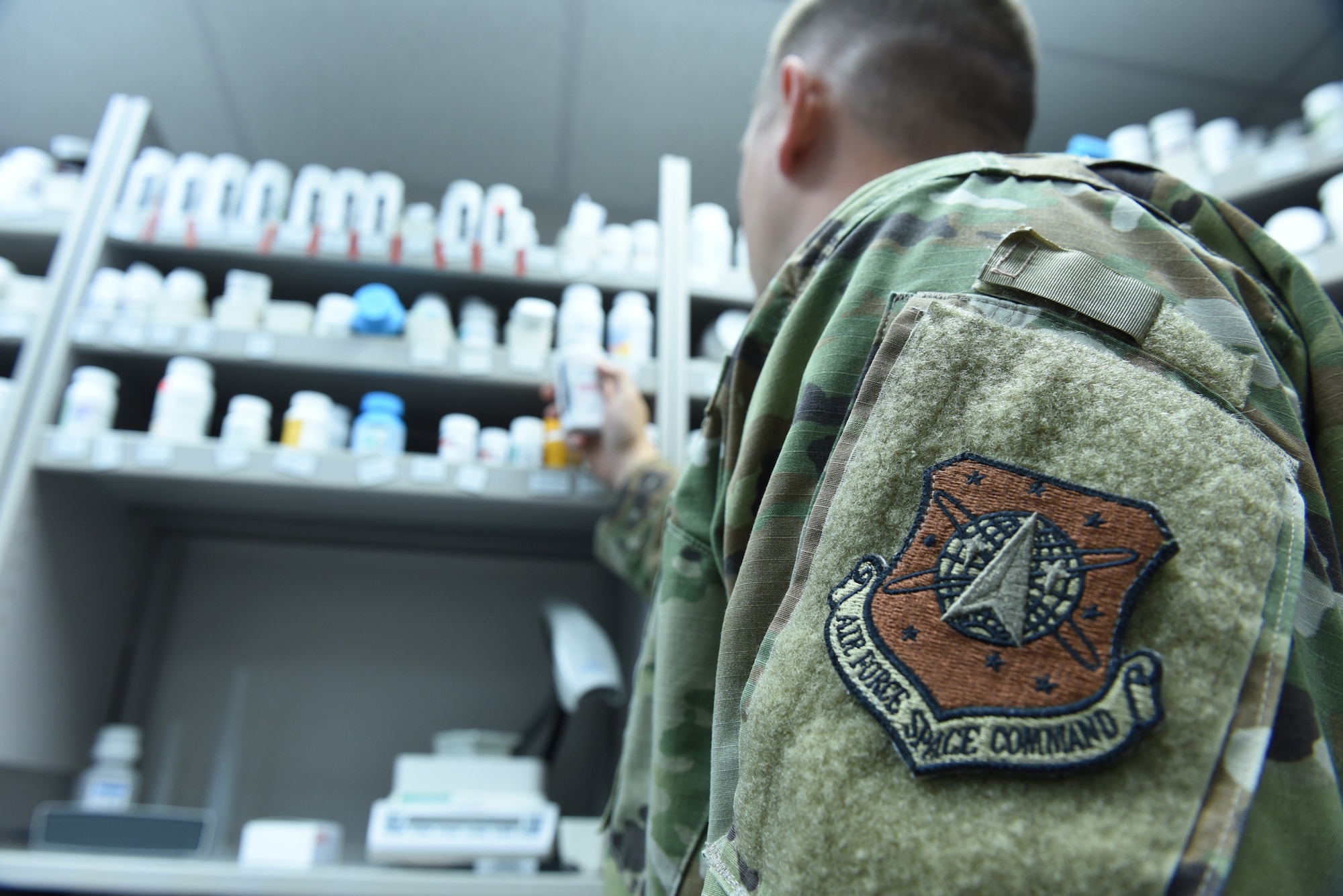 An Airman with the 21st Medical group checks a prescription at the Schriever Air Force Base, Colorado, pharmacy Sept. 11, 2019. Airmen who are part of the 21st Medical Group will become integrated with the Defense Health Agency beginning Oct. 1, which has the four-part aim of improved readiness, better health, better care and lower costs. (U.S. Air Force photo by Master Sgt. Brian Bender)