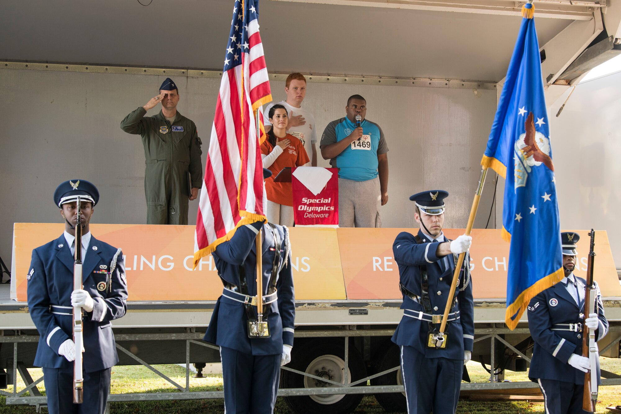 Jordan Little, a contestant, sings the national anthem during the Special Olympics Delaware 2019 cycling tournament Sept. 21, 2019, at Dover Air Force Base, Del. Jordan is a member of the Kent County Wildcats, and this marks another year of him volunteering to sing the national anthem. (U.S. Air Force photo by Senior Airman Christopher Quail)